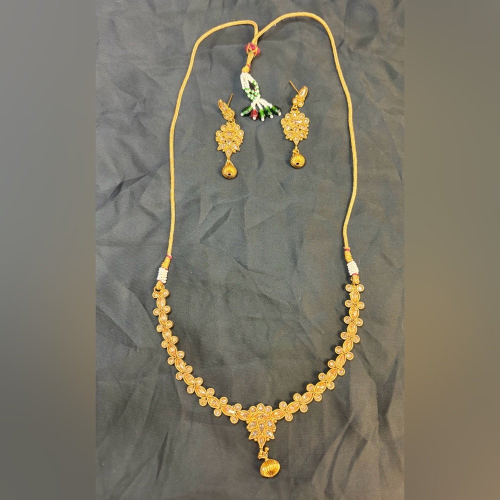 Gold tone and rhinestone necklace and earring set